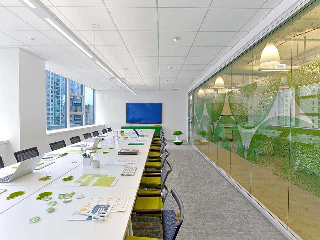 Green cheeky apple themed interior design for teacher's office conference room