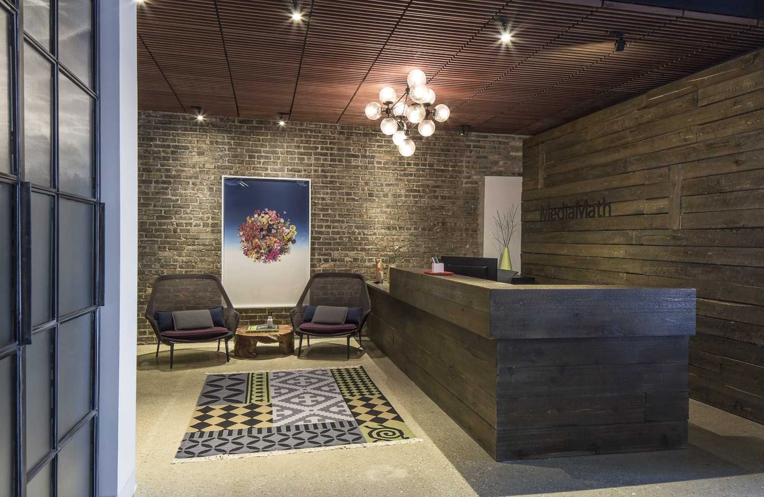industrial tech lobby with brick wall and concrete floor