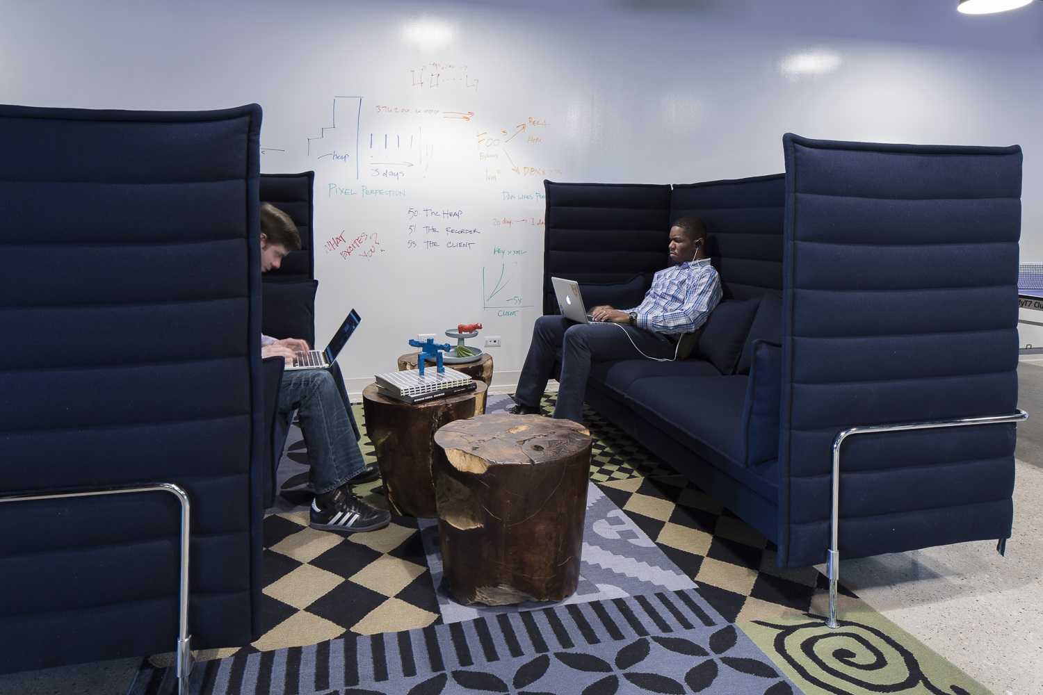 large navy couches in break room