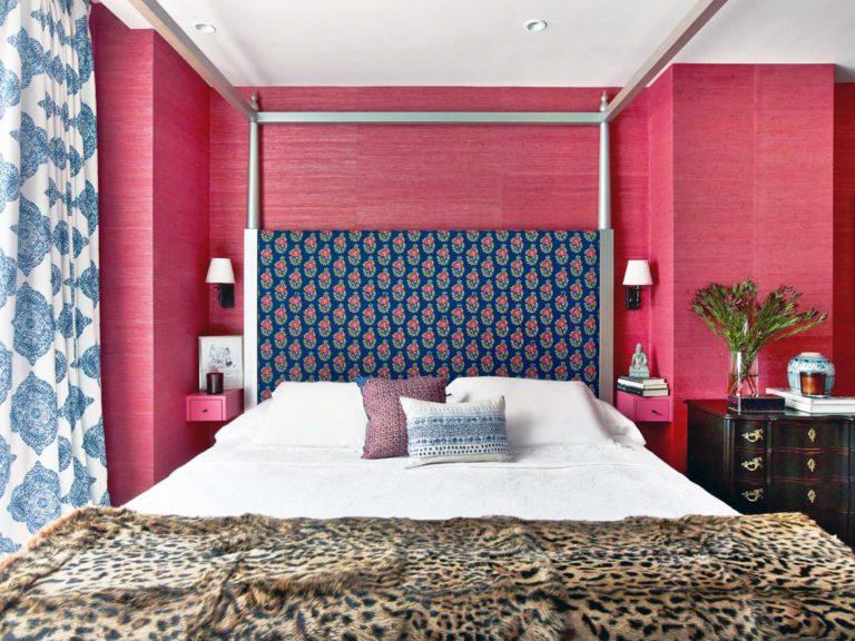red guest bedroom with blue ceiling and blue rug