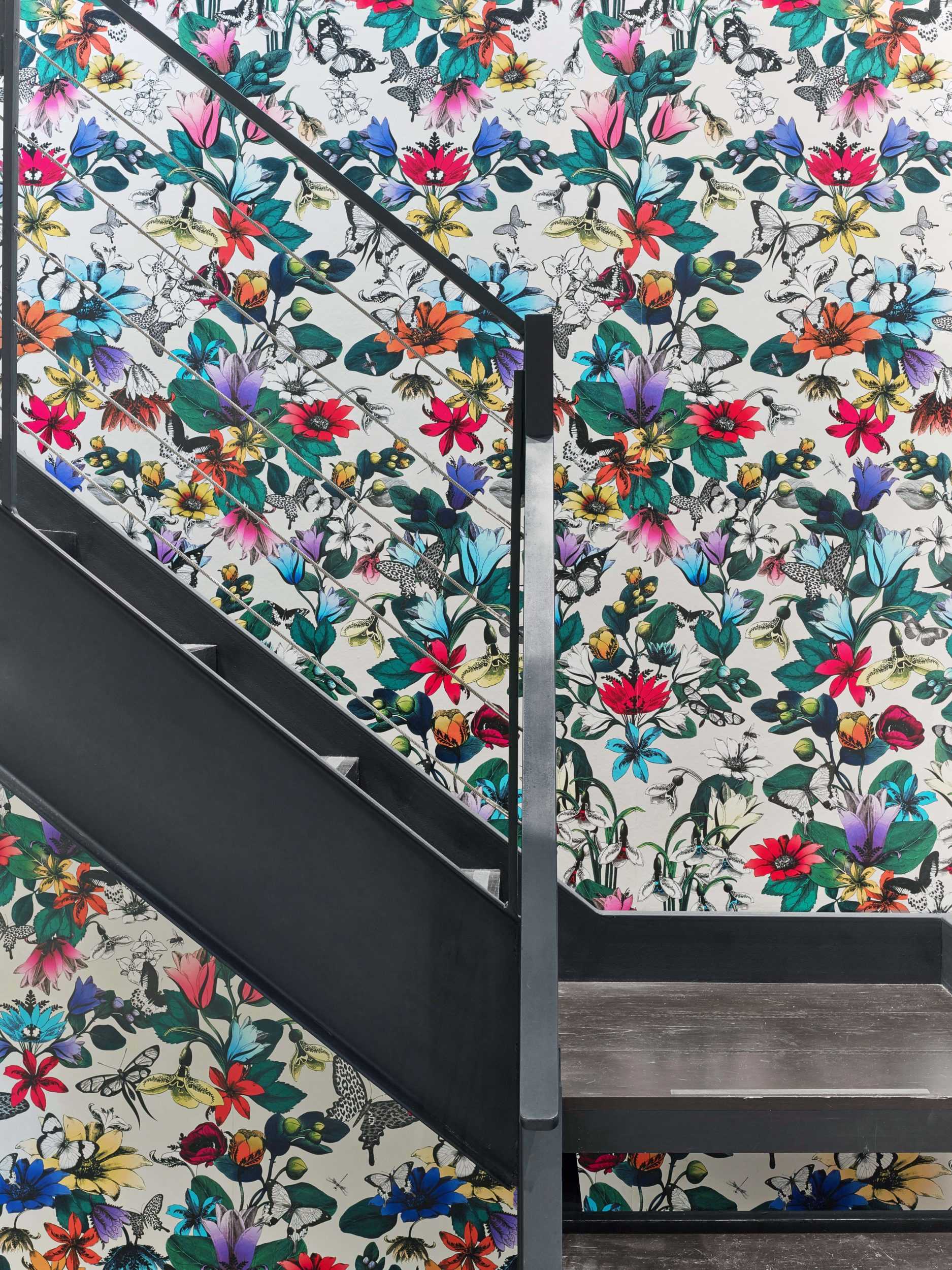 bright floral wallpaper on metal staircase