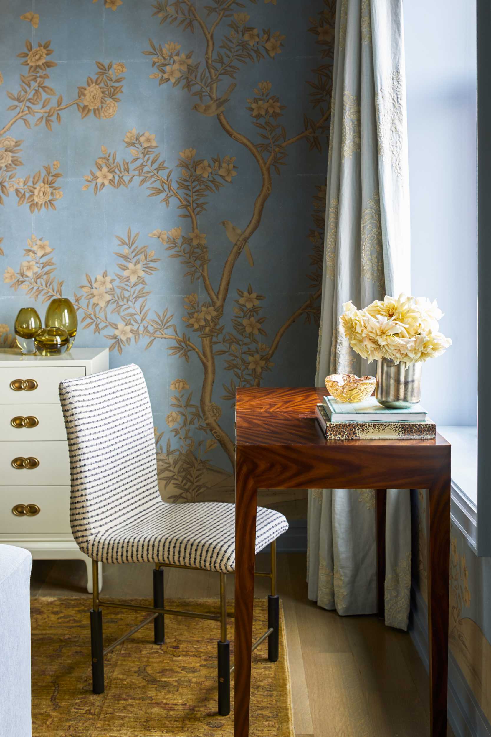 calm glamorous blue bedroom with white desk chair and wooden desk