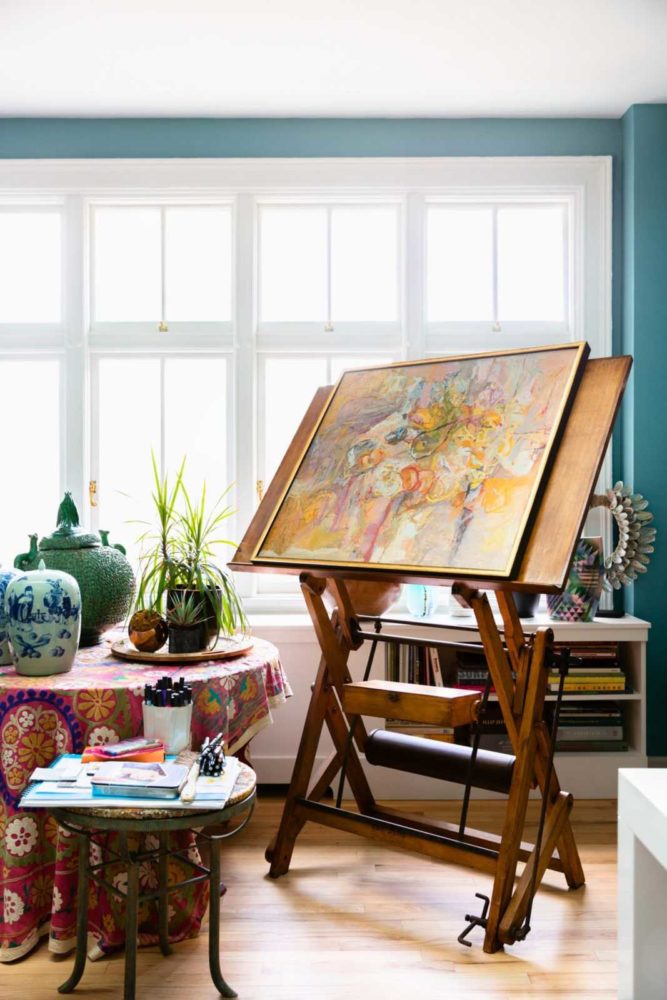 Sun drenched studio with colorful vintage easel 